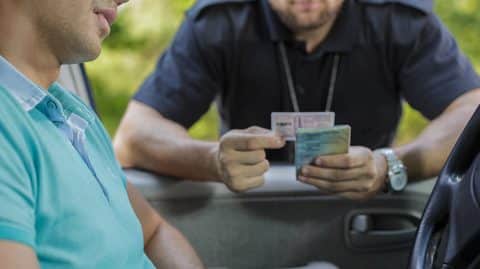 police officer checking driver's license