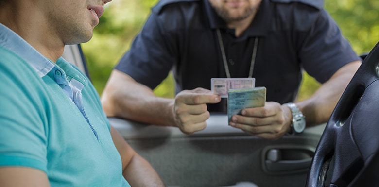 police officer checking driver's license