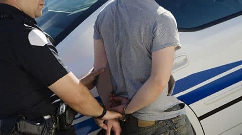 sex offender being handcuffed