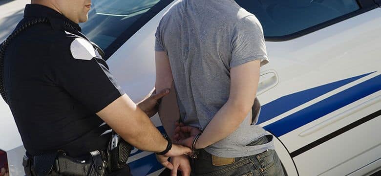 sex offender being handcuffed