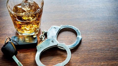 Keys, Drink, and Handcuffs