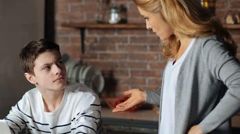 angry mother talking to teenage son