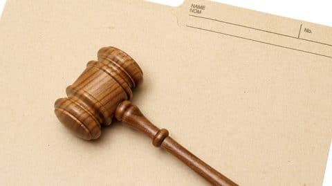 gavel sitting on top of folder