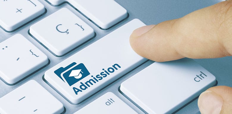 Computer button with the word "admission" on it