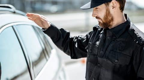 police officer gaining access to car image