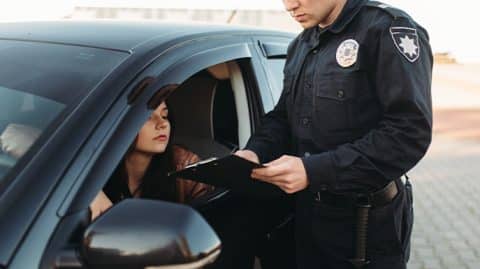 Woman pulled over by police officer image