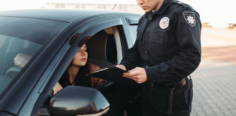 Woman pulled over by police officer image