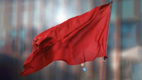 Red flag in front of building