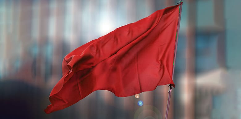 Red flag in front of building