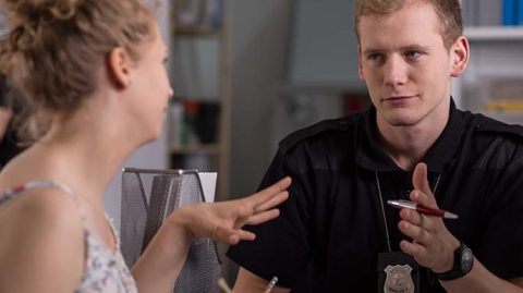 Woman talking to a police officer