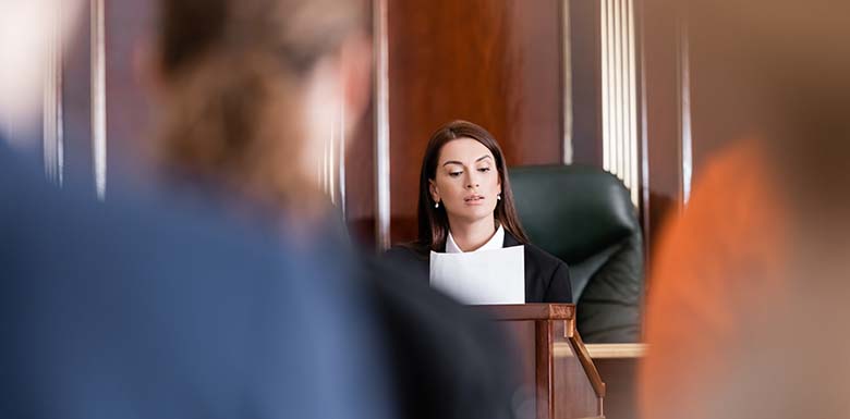 Woman in court reading paper