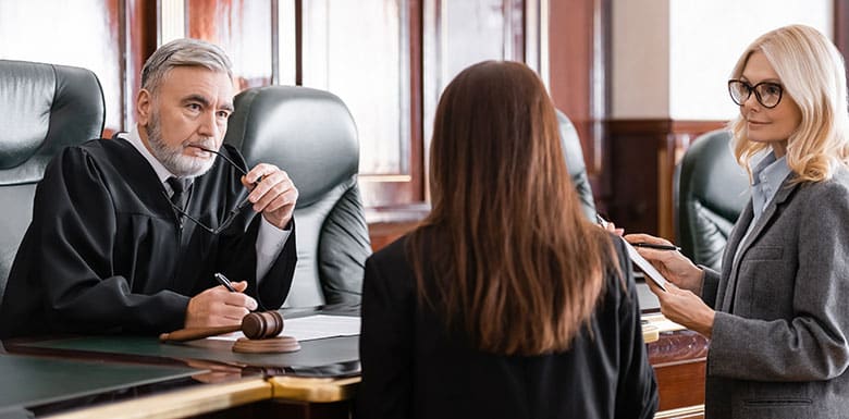 Defendant at a preliminary court hearing in front of a judge