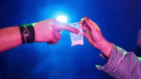 An adult sells drugs to a minor